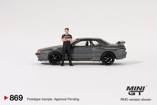 Mini GT - 1:64 Nissan Skyline GT-R R32 Nismo Gunmetal with Matsuda Figure Tsugio Matsuda Collection